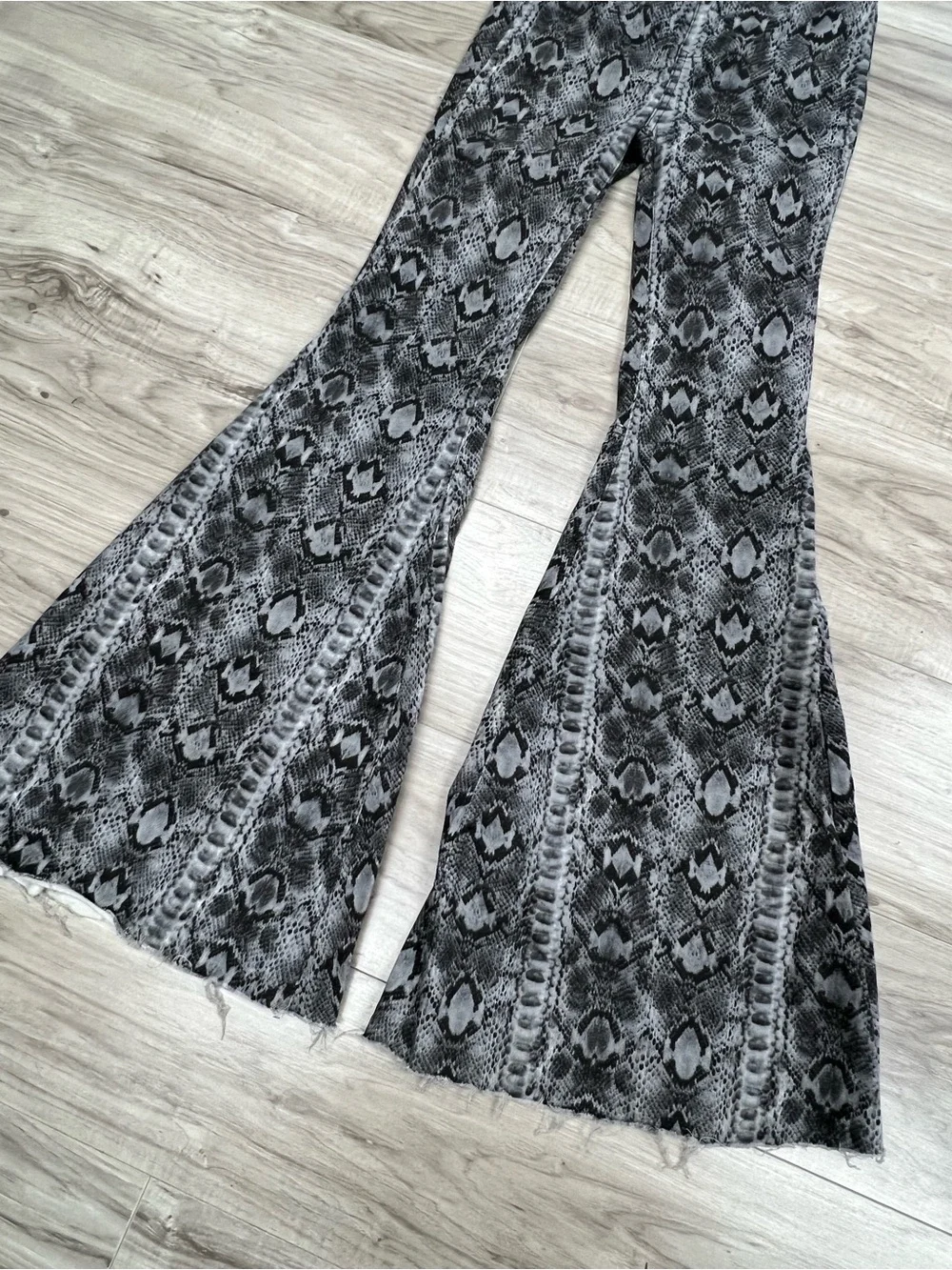 We The Free Free People Just Float On Snake Print Flare Bell Bottom Jeans